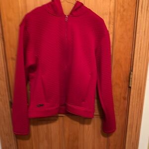 Bright red quilted jacket by Nike in size M.
